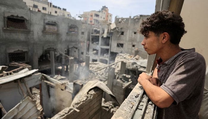 Palestinians inspect the site of a Friday Israeli air strike on houses, at Shati (Beach) refugee camp in Gaza City, May 9, 2026. — Reuters