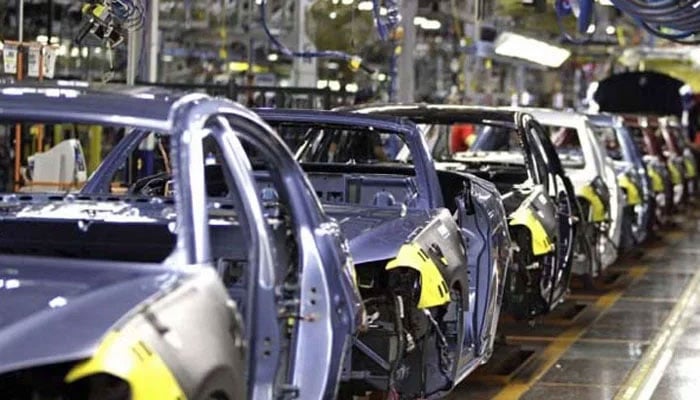 Partly finished vehicles are seen at a manufacturing plant in this undated photo. — APP/File