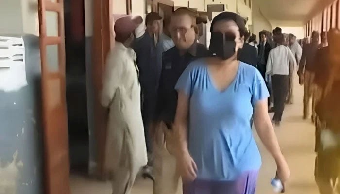 Police produce alleged drug peddler Anmol alias Pinky before a local court in Karachi on May 12, 2026. — YouTube/Geo News/screengrab