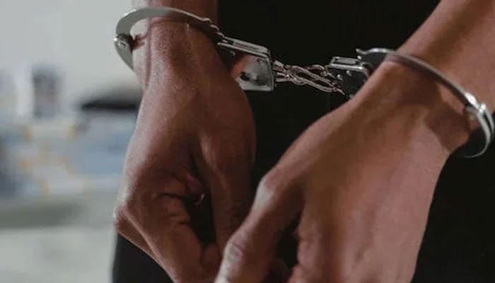 Representational image of a handcuffed man. — APP File