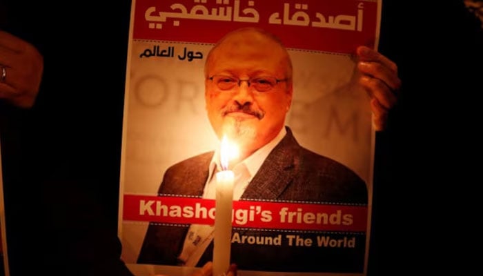 A demonstrator holds a poster with a picture of Saudi journalist Jamal Khashoggi outside the Saudi Arabia consulate in Istanbul, Turkey, October 25, 2018.—Reuters