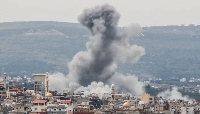 A photograph taken from the southern area of Tyre shows smoke rising from the site of an Israeli airstrike that targeted the area of Ras Al-Ain on May 12, 2026.—AFP