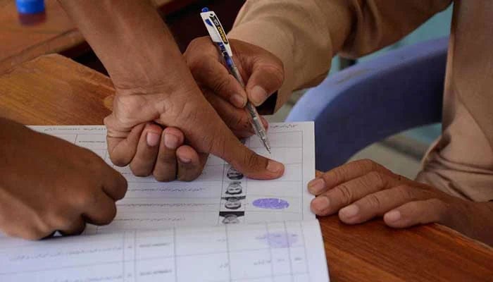 A person casting a vote during an election. — APP/File