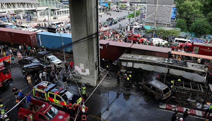 Emergency services work at a site where a train collided with a bus, several cars, and motorcycles on Asok-Din Daeng Road, causing several casualties, in Bangkok, Thailand, on May 16, 2026.—Reuters
