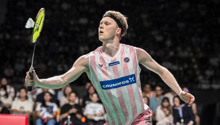Denmarks Anders Antonsen hitting a shot. —AFP