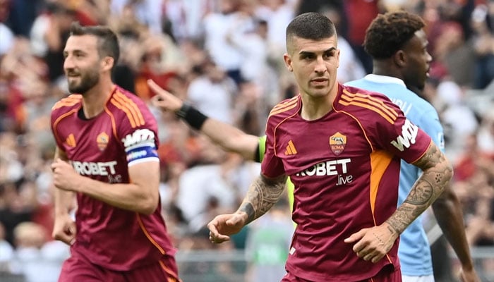 Romas Italian defender Gianluca Mancini celebrates scoring his teams second goal during the Italian Serie A football match between Roma and Lazio at Olympic Stadium in Rome on May 17, 2026. —AFP