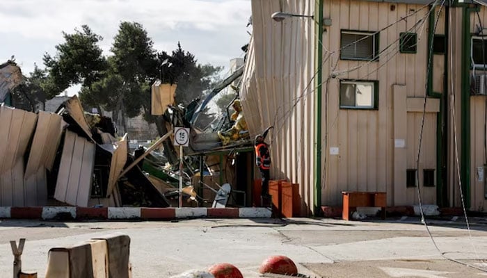 A man handles fallen cables at the Jerusalem headquarters of the United Nations Relief and Works Agency for Palestine Refugees (UNRWA) as the headquarters is dismantled by Israeli forces, in East Jerusalem, January 20, 2026.—Reuters