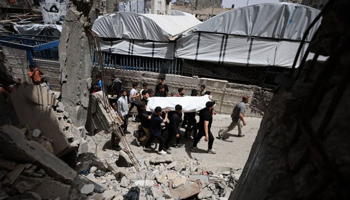 Mourners carry a body during the funeral of Palestinians who were killed in an Israeli strike, according to medics, in Gaza City, May 17, 2026. —Reuters
