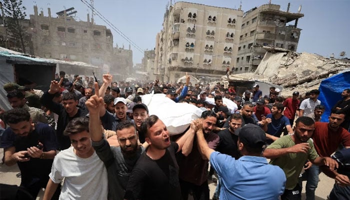 Mourners carry the bodies of Palestinians who were killed in an Israeli strike, according to medics, in Gaza City, May 17, 2026.—Reuters