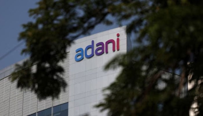 The logo of the Adani Group is seen on the facade of its Corporate House on the outskirts of Ahmedabad, India, November 21, 2024.—Reuters