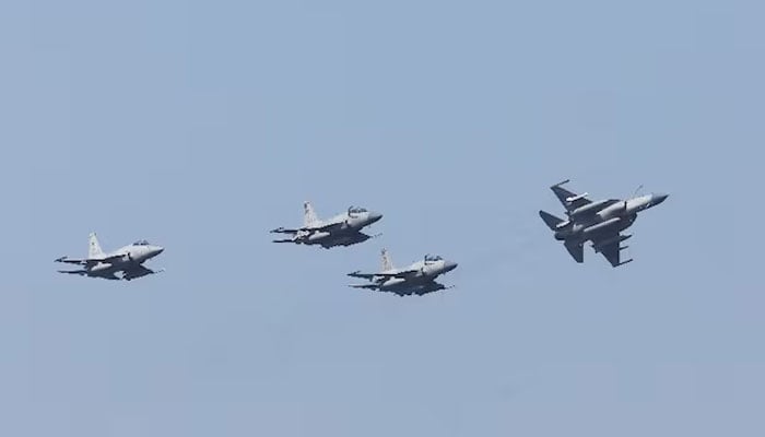 Pakistan Air Forces JF-17 Thunder jets fly past during the sea phase of Pakistan Navys Multinational Exercise AMAN-23, in the North Arabian Sea near Karachi, Pakistan, February 13, 2023.—Reuters