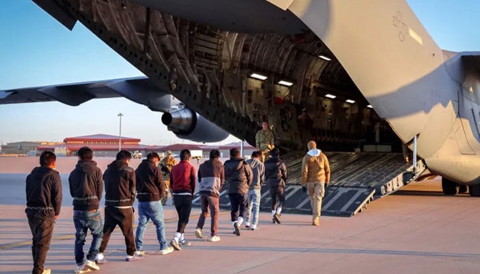 A representational image shows a group of migrants boarding a deportation flight. — X/Karoline Leavitt/@PressSec/File