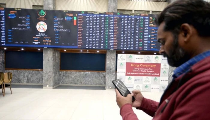 Broker is busy in trading at Pakistan Stock Exchange (PSX) in Karachi on Wednesday, December 31, 2025. — PPI