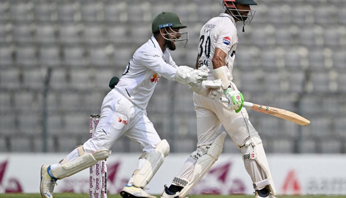 Bangladeshs Litton Das (left) celebrates after the dismissal of Pakistan captain Shan Masood (R). —AFP