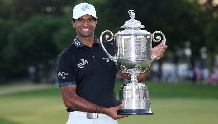 Aaron Rai of England celebrates with The Wanamaker Trophy after victory during the final round of the PGA Championship at Aronimink Golf Club on May 17, 2026, in Newtown, Pennsylvania. —AFP