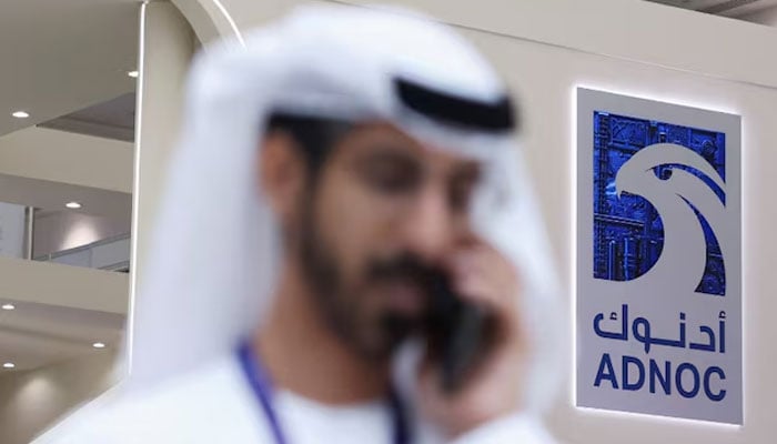 A logo of ADNOC is displayed at the Make it in the Emirates (MIITE) conference, in Abu Dhabi, United Arab Emirates, May 4, 2026.—Reuters