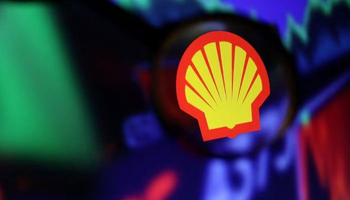 Shell logo and stock graph are seen through a magnifier in this illustration taken September 4, 2022, in reference to Shell’s announcement to exit Pakistan as the energy major winds down its operations in the country. — Reuters