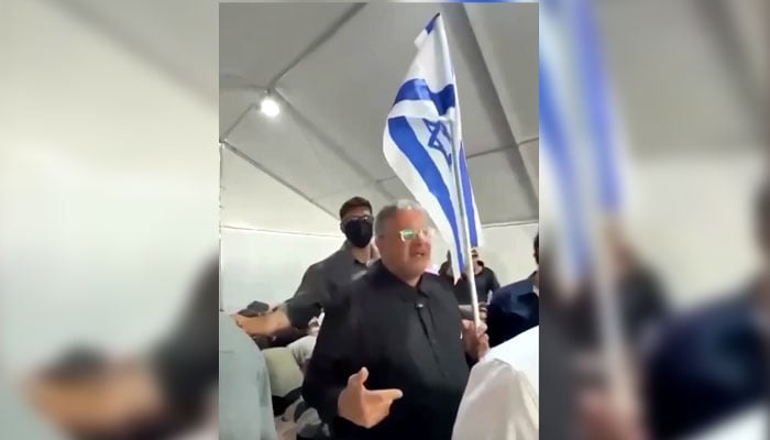 A screenshot from a video posted by Reuters shows Israeli minister Itamar Ben-Gvir holding an Israeli flag and taunting activists and saying welcome to Israel. —Screengrab via Reuters