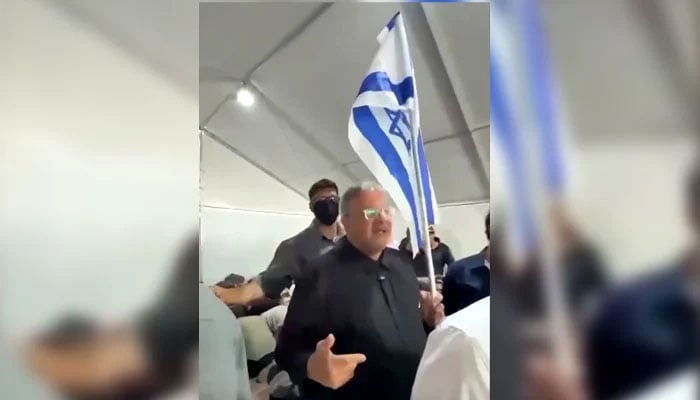 A screenshot from a video posted by Reuters shows Israeli minister Itamar Ben-Gvir holding an Israeli flag and taunting activists and saying welcome to Israel. —Screengrab via Reuters