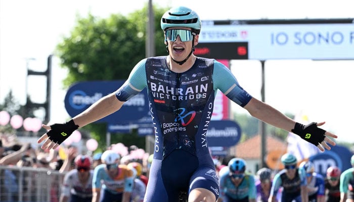 Victorious Alec Segaert celebrates winning stage 12. —AFP