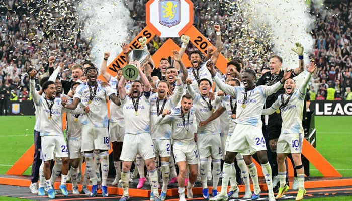Aston Villas Scottish midfielder John McGinn and his teammates celebrate with the trophy after winning the UEFA Europa League final football match between SC Freiburg and Aston Villa at Besiktas Park in Istanbul on May 20, 2026. —AFP
