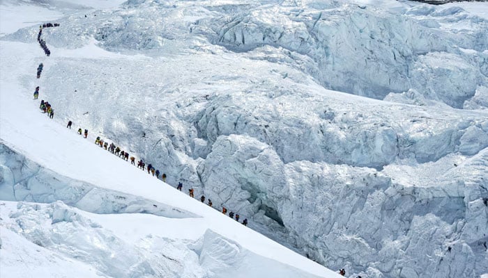 Climbers walk in a long queue as they head to the summit Mount Everest in the Solukhumbu district, also known as the Everest region, Nepal, May 18, 2026.—Reuters