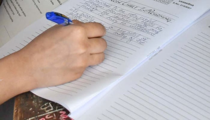 Representational image shows a student attempting their question paper in Karachi, on April 10, 2026. — Online