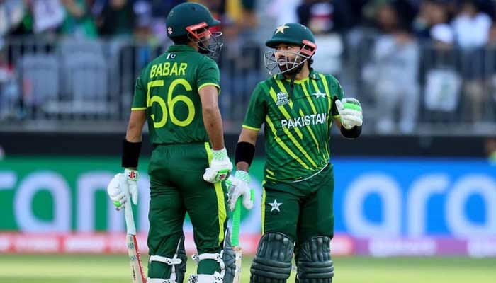 Pakistan batters Babar Azam (left) and Mohammad Rizwan bump fists during a match against New Zealand in Lahore, on April 15, 2023. — X/@TheRealPCB