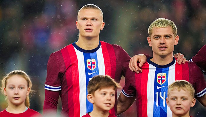 Norways Erling Braut Haaland and Julian Ryerson line up during the national anthems before the match, International Friendly - Norway v Slovakia - Ullevaal Stadium, Oslo, Norway - March 26, 2024. — Reuters