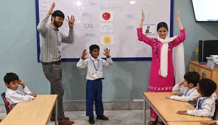 A representational image taken on May 6, 2024 shows teachers leading a class of hearing-impaired students at a school. — AFP/File
