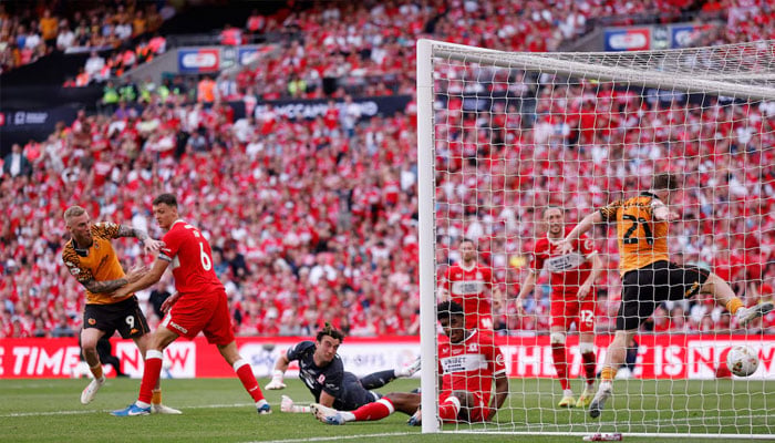 Hull Citys Oliver McBurnie scores their first goal, May 23, 2026. —AFP