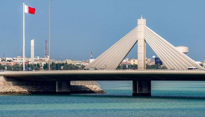 Vehicles move along the Muharraq Bridge in Bahrains capital Manama on March 11, 2026. —AFP