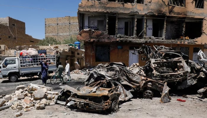 Residents stand next to a damaged building, rubble and destroyed cars a day after a blast in Quetta, Pakistan May 25, 2026.—Reuters