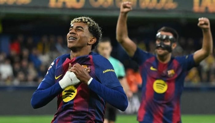 Barcelonas Spanish forward Lamine Yamal celebrates scoring his teams second goal during the Spanish league football match between Villarreal CF and FC Barcelona at La Ceramica Stadium in Vila-real on December 21, 2025. —AFP