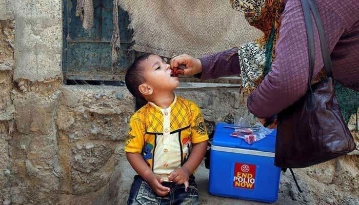 A boy receives polio vaccine drops during an anti-polio campaign. — Reuters/File