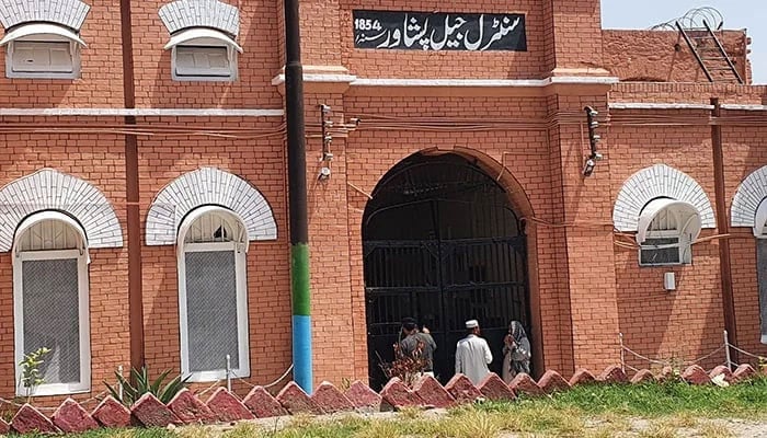 Visitors stand at main gate of the central jail in Peshawar in this undated photo. — Facebook@Central Prison Peshawar