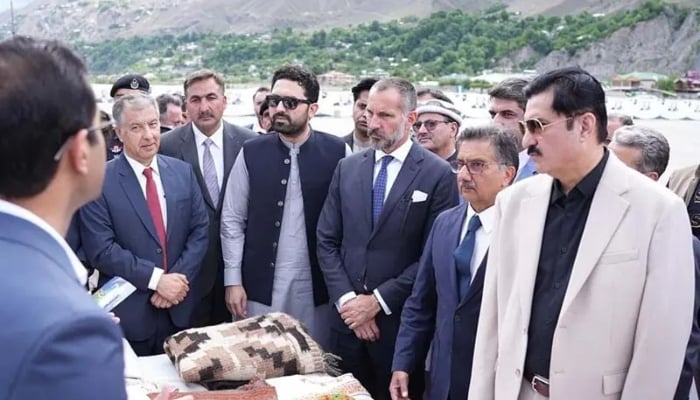 Khyber Pakhtunkhwa Chief Minister Sohail Afridi (C), Prince Rahim al-Hussaini Aga Khan V and other officials take part in a meeting at Lower Chitral Airport in Gilgit Baltistan on May 25, 2026. — X/PTIKPOfficial