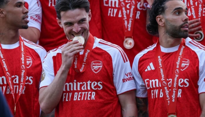This image shows Arsenal players holding medals. —AFP/File