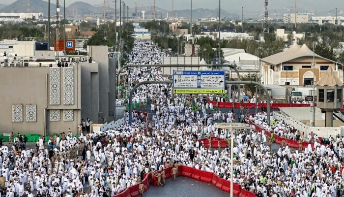 Muslims pray near Saudi Arabias Mount Arafat, also known as Jabal al-Rahma or Mount of Mercy, during the climax of Haj early on May 26, 2026. —AFP