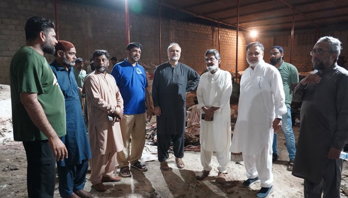 Jamaat-i-Islami (JI) Emir Hafiz Naeemur Rehman visits a collective sacrifice centre in Karachi on May 27, 2026. — Facebook@HafizNaeemRehman