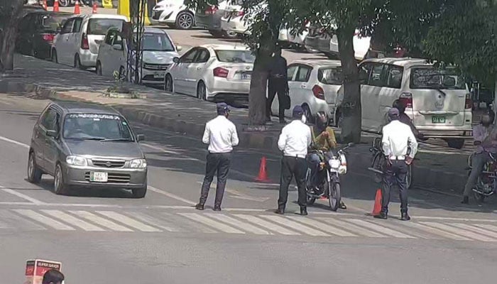 Punjab traffic officials perform duty in the provincial capital on May 8, 2026. — Facebook@citytraffic.policelhr