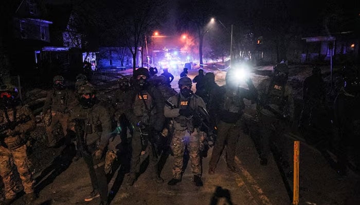 Federal agents stand guard, as tensions rise after federal law enforcement agents were involved in a shooting incident, a week after a US Immigration and Customs Enforcement (ICE) agent fatally shot Renee Nicole Good, in north Minneapolis, Minnesota, US, January 14, 2026. — Reuters