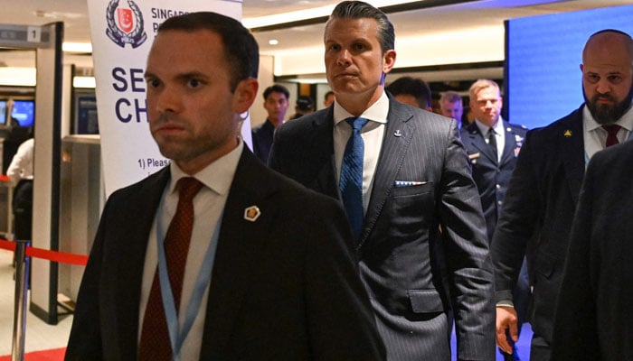 Pentagon chief Pete Hegseth  (C) arrives for a bilateral meeting with Singapores Minister for Defence Chan Chun Sing on the sidelines of the Shangri-La Dialogue Summit in Singapore on May 29, 2026. — AFP