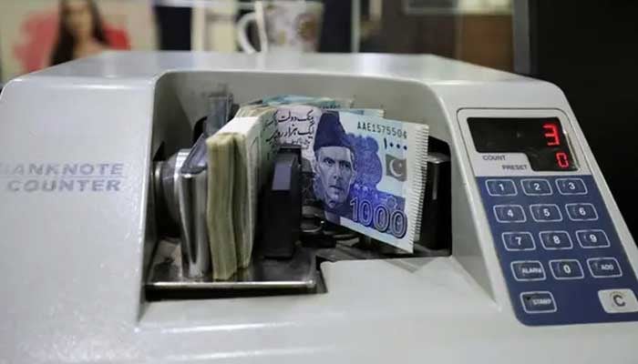 Pakistani rupee notes are seen in a counting machine at a bank in Peshawar, Pakistan August 22, 2023. — Reuters