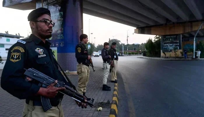 The Karachi Police officials can be seen standing guard. — AFP/File