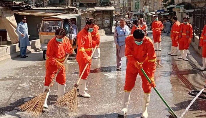 Water and Sanitation Services Peshawar (WSSP) workers are seen cleaning roads during Eid ul Adha in Peshawar on May 30, 2026. — Facebook/Commissioner Peshawar Division, Peshawar