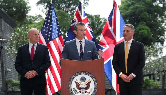 Australian Defence Minister Richard Marles and British Defence Secretary John Healey look on as US Secretary of Defense Pete Hegseth speaks during an AUKUS Defence ministers press huddle at the US Embassy in Singapore, May 30, 2026.—Reuters