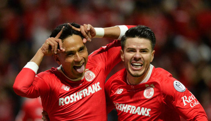 Tolucas Jorge Diaz celebrates scoring his teams goal in their CONCACAF Champions Cup final victory over Tigres UANL. —AFP