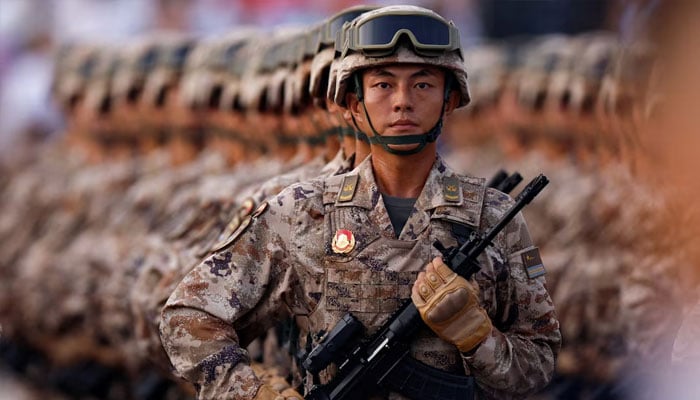 Chinas cyber force personnel march during the rehearsal ahead of a military parade to mark the 80th anniversary of the end of World War Two, in Beijing, China, September 3, 2025.—Reuters