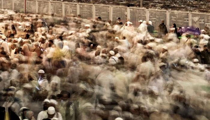 Pilgrims make their way to perform the symbolic stoning of the devil during their Hajj pilgrimage in Mina on May 28, 2026. — AFP